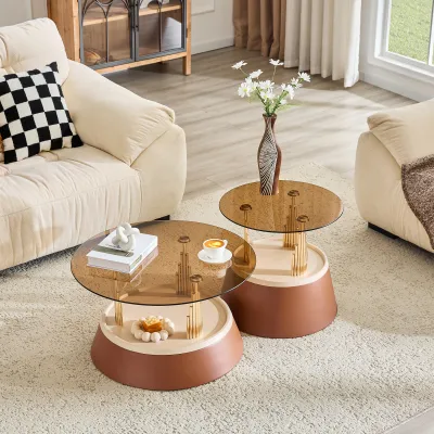Luxury-inspired brown and gold nesting coffee table set. Set of two tiered coffee tables with tea-stained tempered glass. Round living room coffee table, two-piece set.